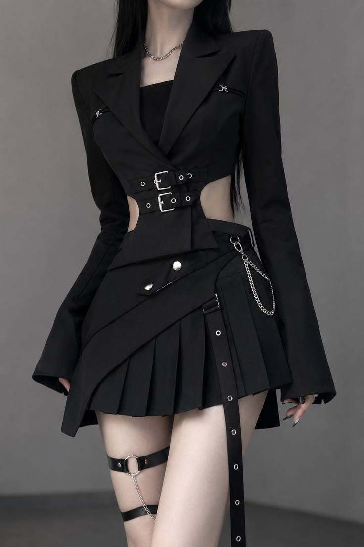 Woman in a black cutout jacket and pleated skirt with garter belt