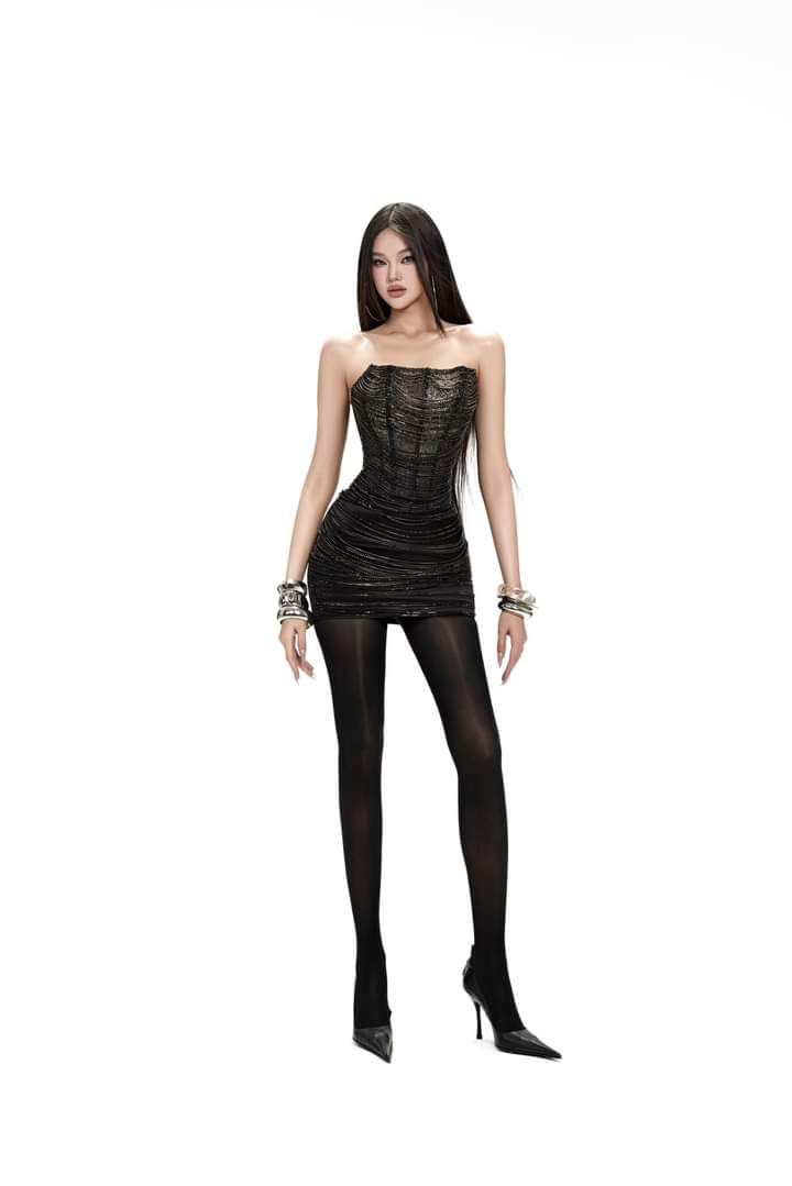 Woman in a black strapless dress and tights with long dark hair