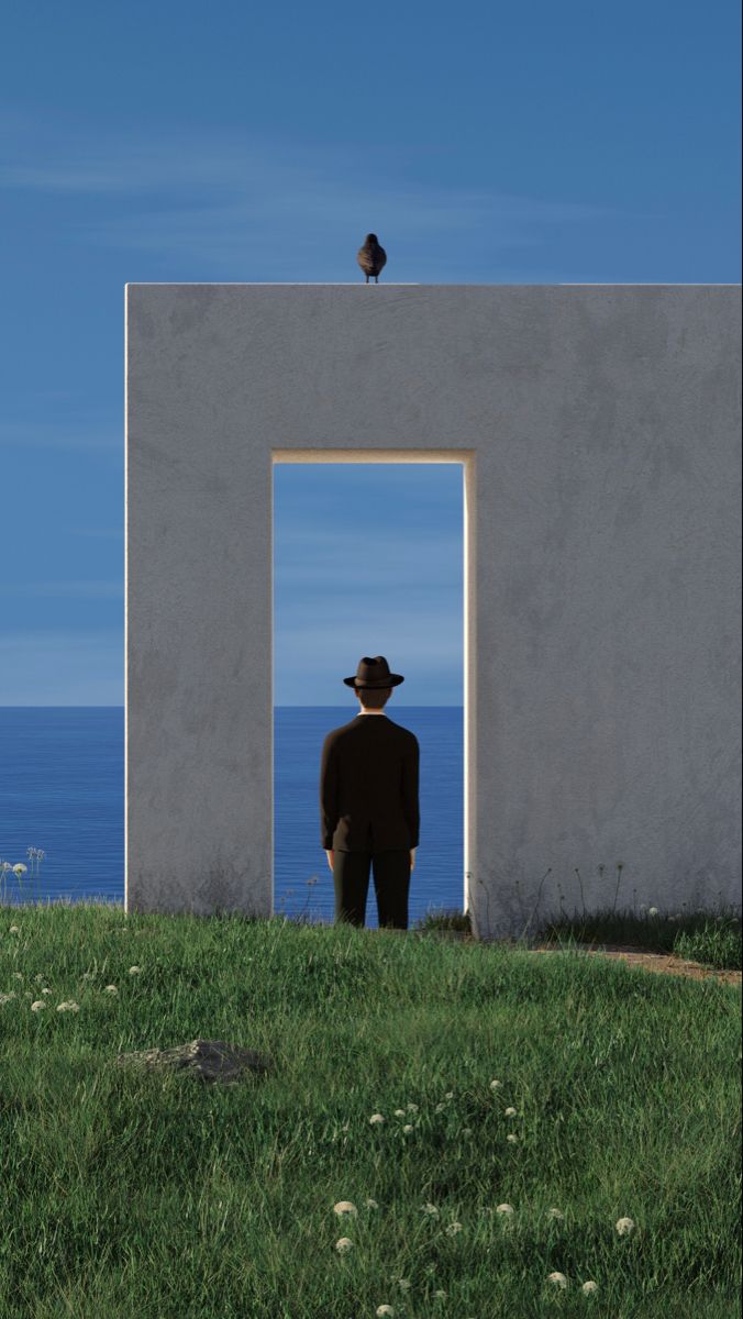 Man in a suit and fedora looking through a doorway at the ocean
