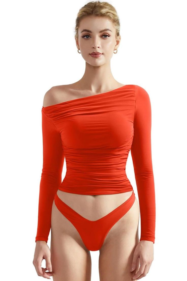 Woman in a red off-shoulder top and red underwear against a white background