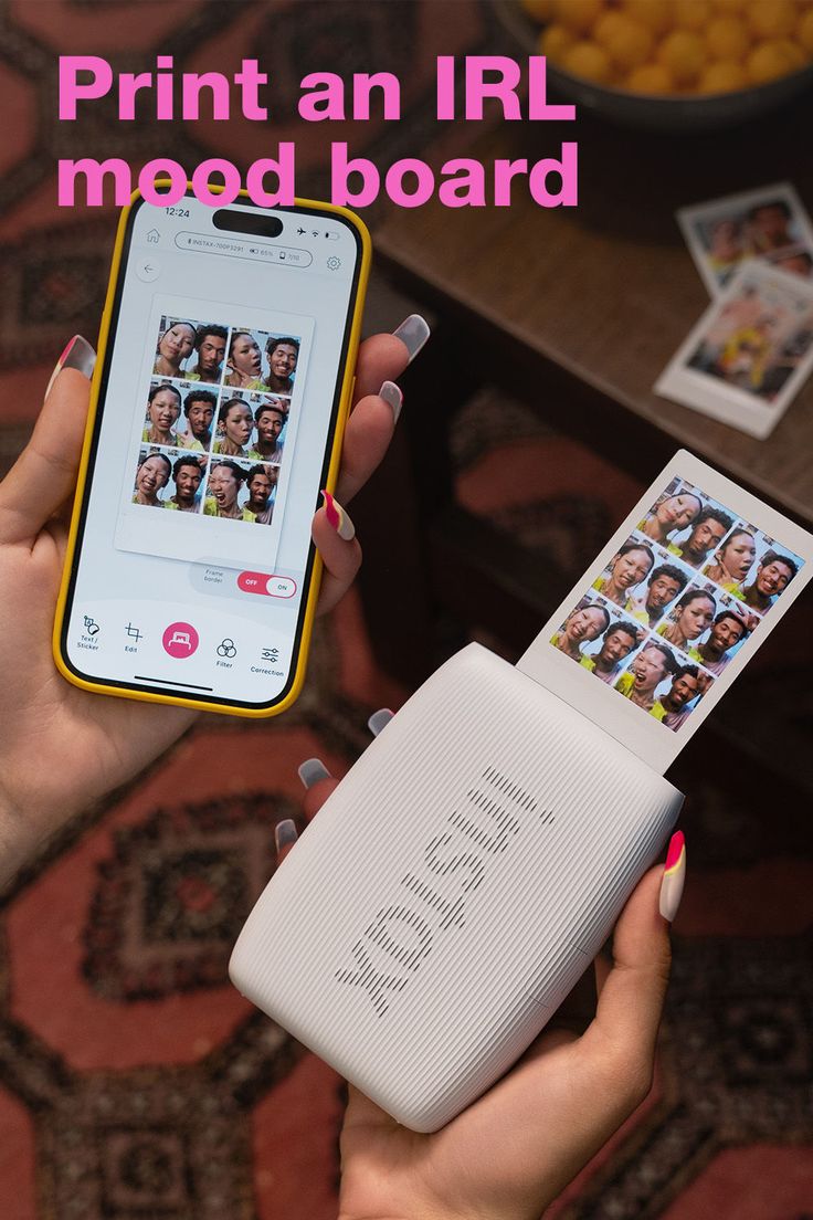 Hands holding a mobile phone and a photo printer with a printed photo collage