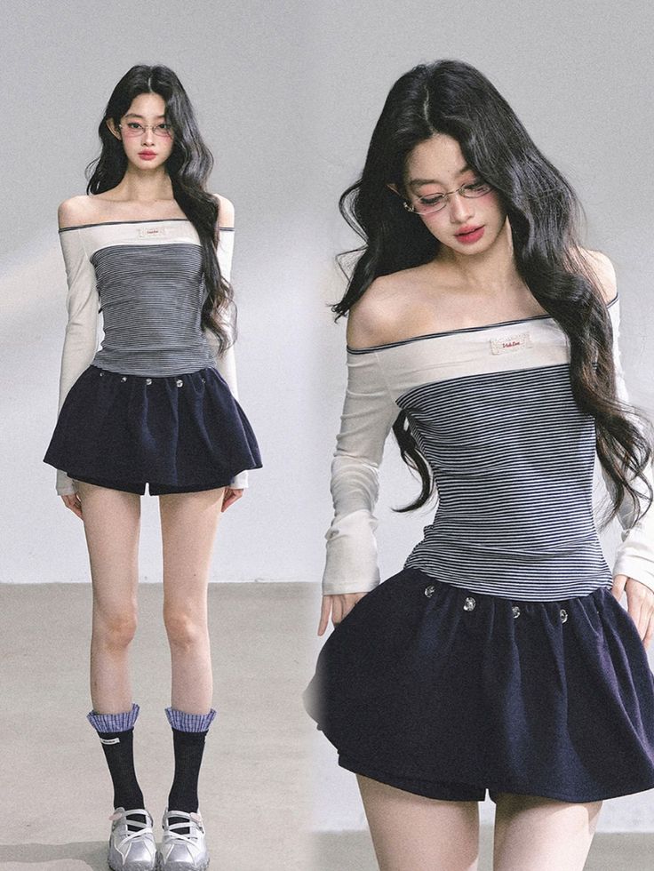 Woman with long dark hair wearing an off-shoulder top and mini skirt in a studio