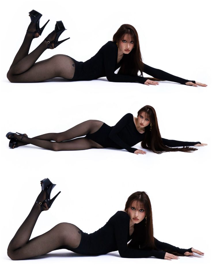 Woman in a black bodysuit and high heels posing on a white background
